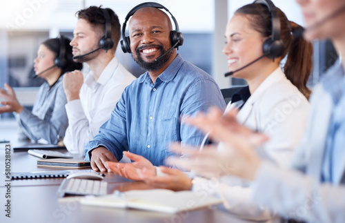 Contact us, call center or portrait of friendly black man in telecom communications company in help desk. Happy smile, crm or face of sales agent working online in technical or customer support