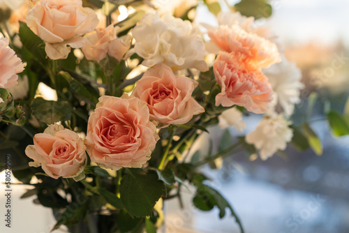 Fototapeta Naklejka Na Ścianę i Meble -  Bouquet of spring roses and chrysanthemums flowers. Bridal bouquet close up