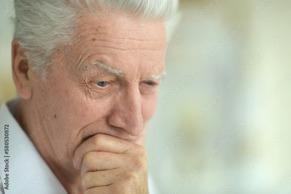 portrait of thoughtful senior man portrait of thoughtful senior man