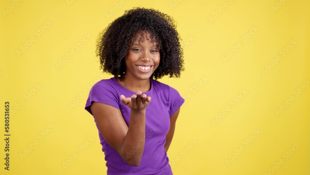 Sensual african woman blowing a kiss while looking at camera Sensual african woman blowing a kiss while looking at camera