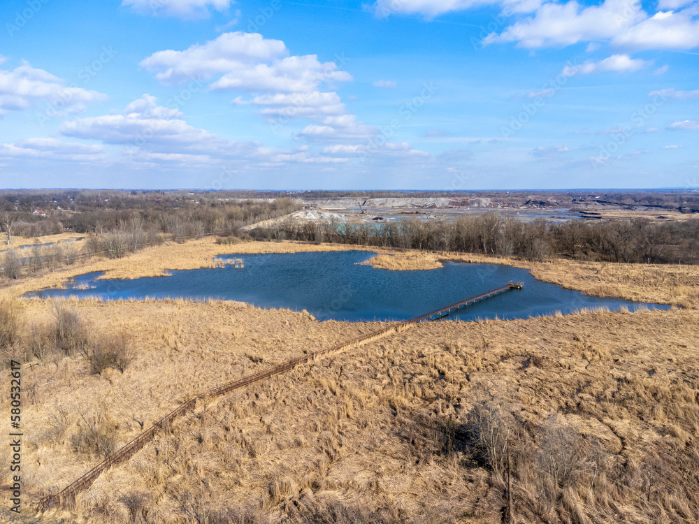 Aerial view landscape. View of water, lake, pond. Blue sky with clouds.