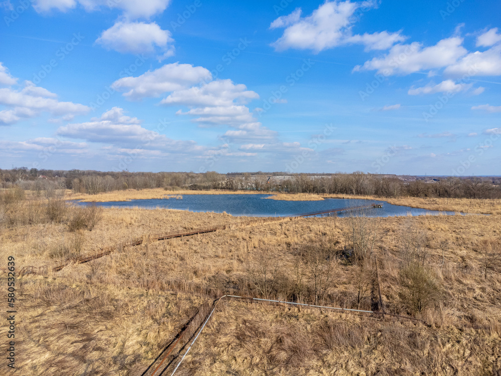Aerial view landscape. View of water, lake, pond. Blue sky with clouds.
