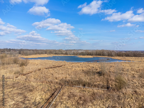 Obraz na płótnie Aerial view landscape. View of water, lake, pond. Blue sky with clouds. w salonie