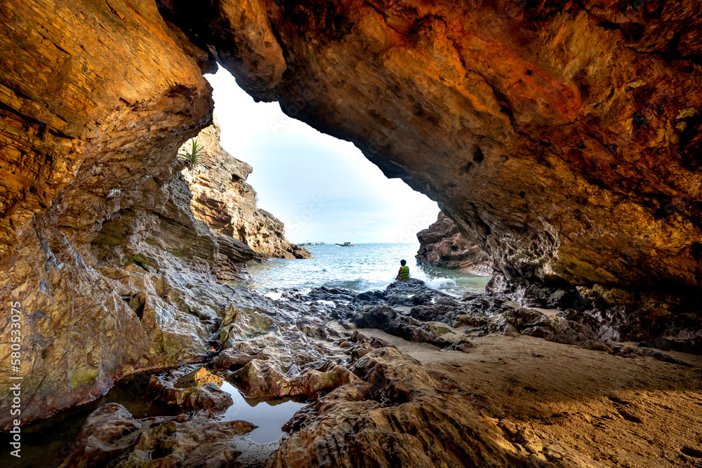 Cave on a sea cliff overlooking the sea in Nghe An province, Vietnam Cave on a sea cliff overlooking the sea in Nghe An province, Vietnam
