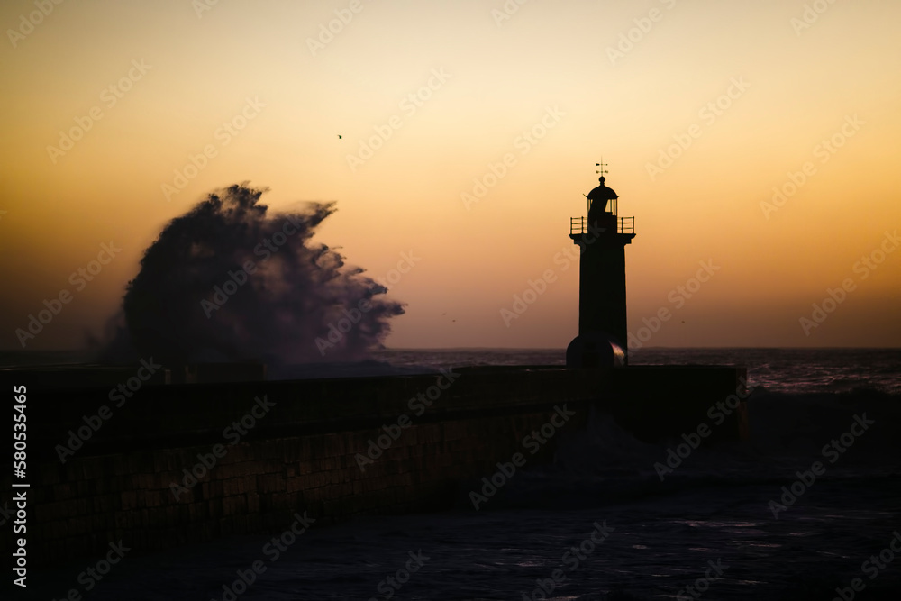 Huge wave on the lighthouse, Atlantic, Porto, Portugal.
