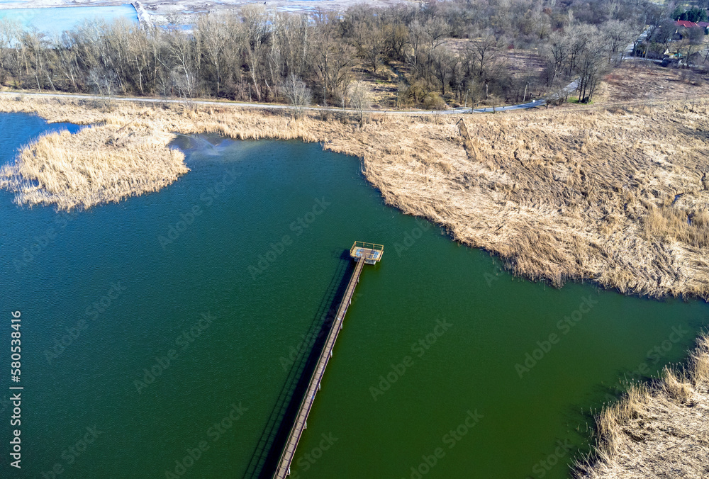 Aerial view landscape. View of water, lake, pond. Photo from a drone. Footbridge, pier.