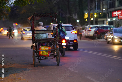 rickshaw driver poor indian Poor rickshaw in Old Delhi photo