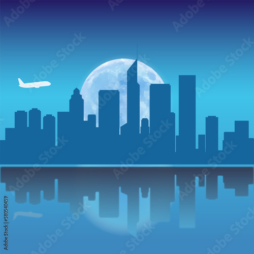 A plane flew over the night sky of the city skyline 