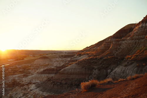 Scenic view of dramatic landscape against clear sky during sunset