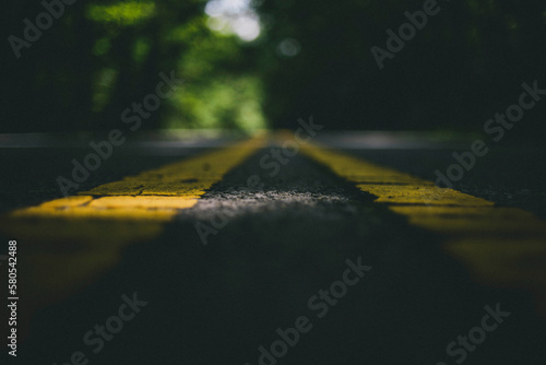 Close-up of road markings on street photo