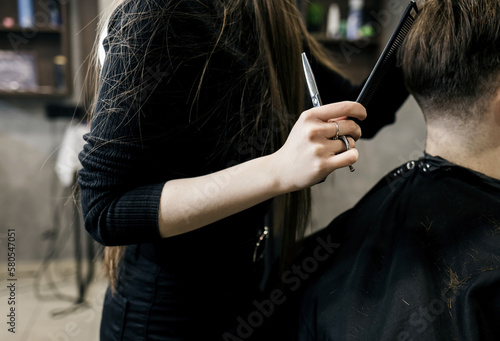 men's hair cutting scissors in a beauty salon.