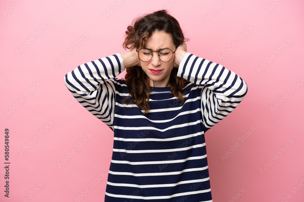 Young caucasian woman isolated on pink background frustrated and covering ears Young caucasian woman isolated on pink background frustrated and covering ears