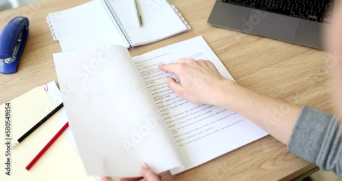 Actor leafing through script for play at table closeup 4k movie slow motion