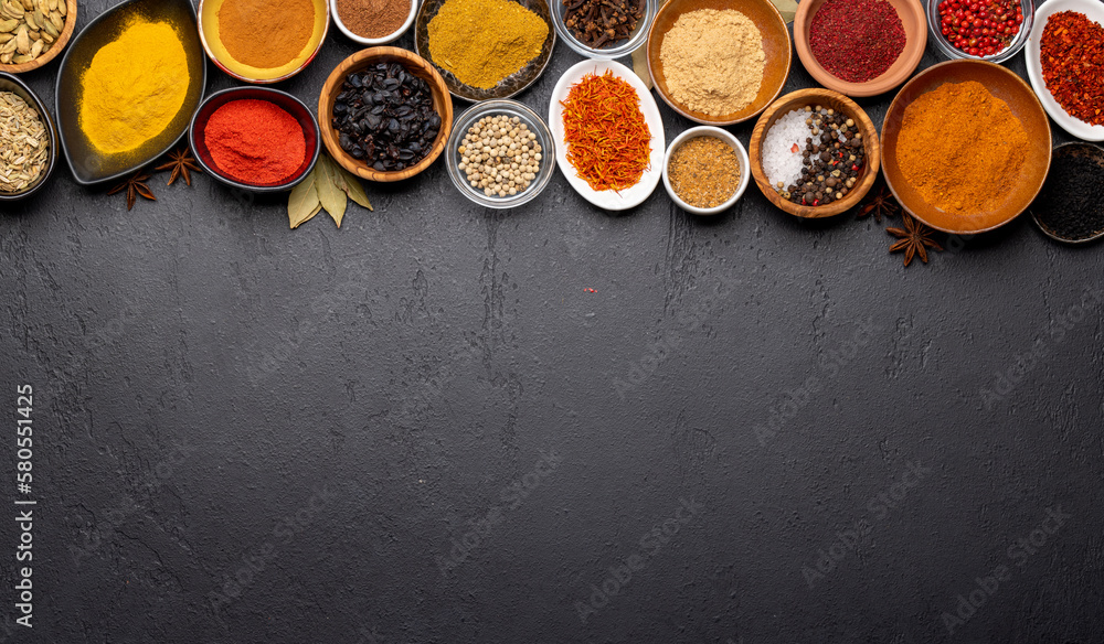 Various spices in bowls on stone table - obrazy, fototapety, plakaty 