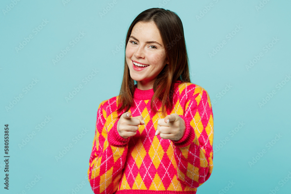 Young confident leader woman wears bright casual clothes point index finger camera on you motivating encourage isolated on plain pastel light blue cyan background studio portrait. Lifestyle concept. Young confident leader woman wears bright casual clothes point index finger camera on you motivating encourage isolated on plain pastel light blue cyan background studio portrait. Lifestyle concept.