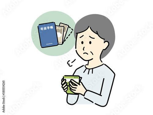 受け取った年金額を確認してため息をするシニア女性