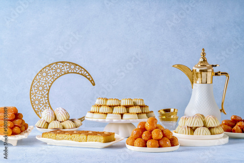 Fototapete Assorted semolina maamoul or mamoul cookies , awameh or lokma with dallah and ramadan decor crescent moon