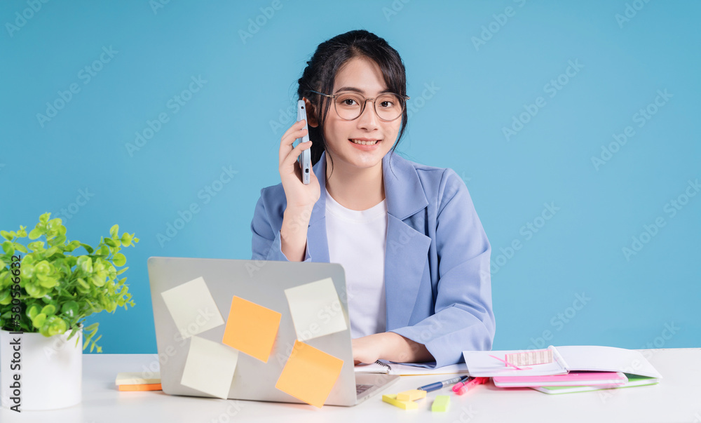 Young Asian businesswoman working on background Young Asian businesswoman working on background