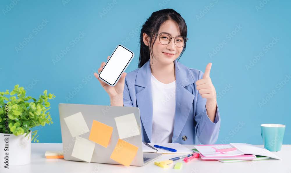 Young Asian businesswoman working on background Young Asian businesswoman working on background