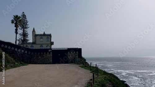 In this Castelinho, a charming house on the waterfront that connects Cascais to Lisbon, located next to the cliffs and the sea beside it, it is said that there are ghosts. photo