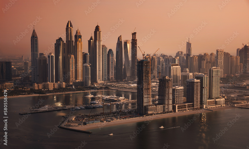 Obraz premium Dubai skyline on sunset, modern city with skyscrapers