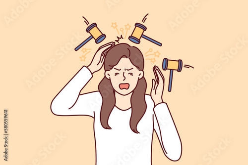 Upset woman experiencing headache standing among hammers symbolizing buzzing in ears or noise from neighbors. girl suffers from headache and needs medicines for migraine and other diseases 