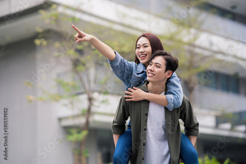 Photo of young Asian couple outdoor