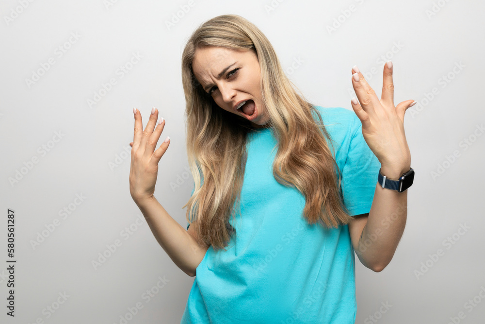 girl making a face on a white studio background girl making a face on a white studio background