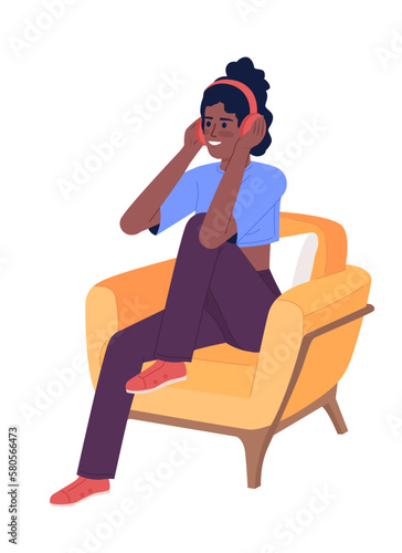 Sporty girl with headphones in armchair semi flat color vector character. Editable figure. Full body person on white. Simple cartoon style spot illustration for web graphic design and animation