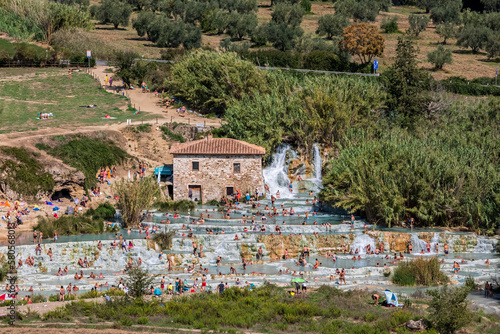 Italy, Tuscany, Saturnia, People bathing in Cascate del Mulino thermal pool photo
