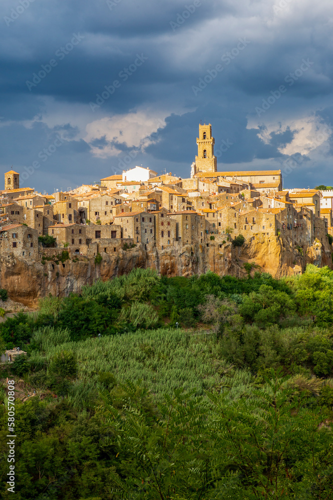 Italy, Tuscany, Pitigliano, Cloudy sky over edge of old medieval town in summer Italy, Tuscany, Pitigliano, Cloudy sky over edge of old medieval town in summer