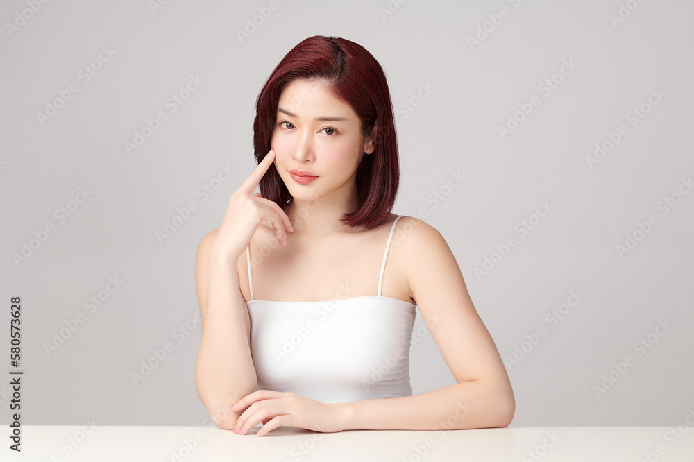 Beautiful young asian woman with clean fresh skin on grey background, Face care, Facial treatment, Cosmetology, beauty and spa, Asian women portrait. Beautiful young asian woman with clean fresh skin on grey background, Face care, Facial treatment, Cosmetology, beauty and spa, Asian women portrait.
