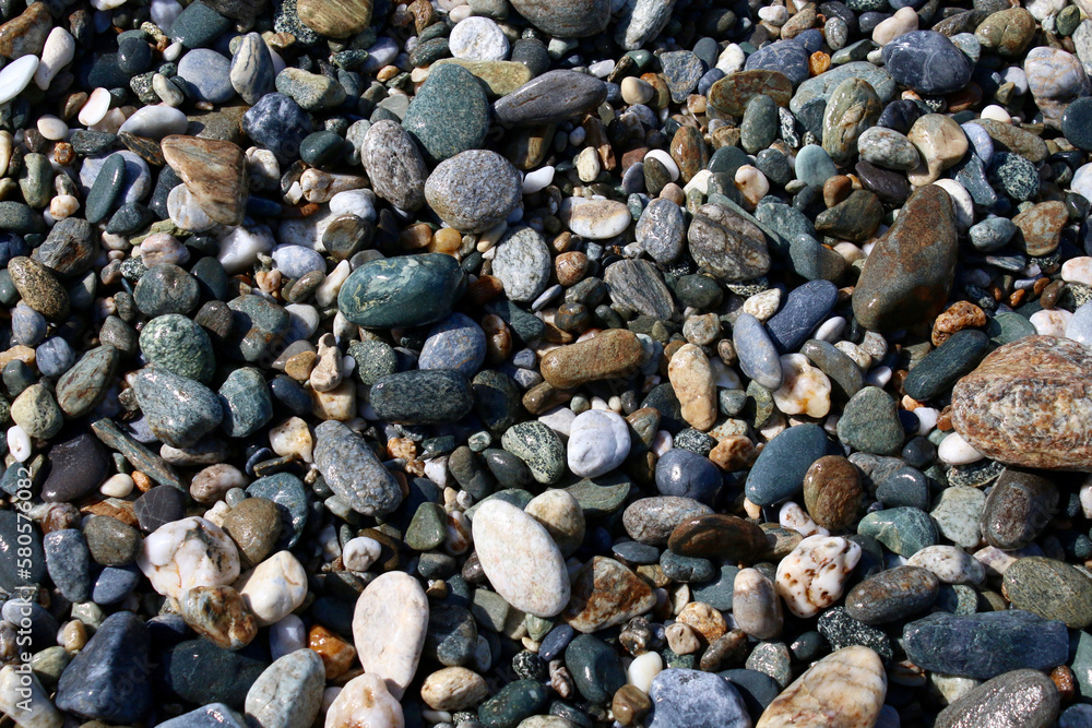 Rocky beach. Wet sea stones on the seashore. Rocky beach. Wet sea stones on the seashore.