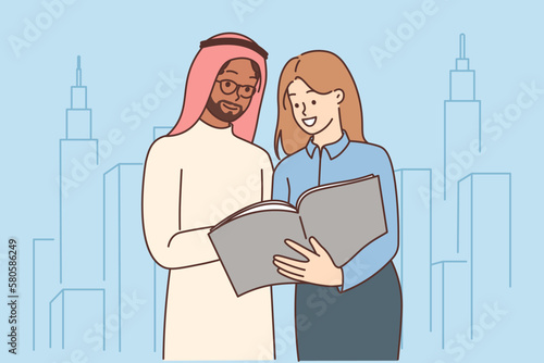 Female contractor show project to Arabic businessman 