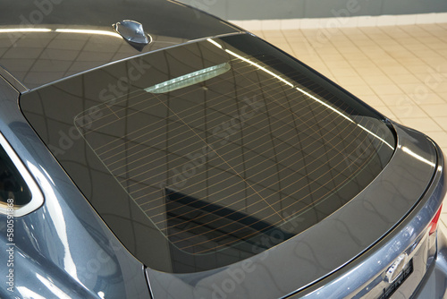 gray premium car rear window, glass heating system. fin air divider on car roof