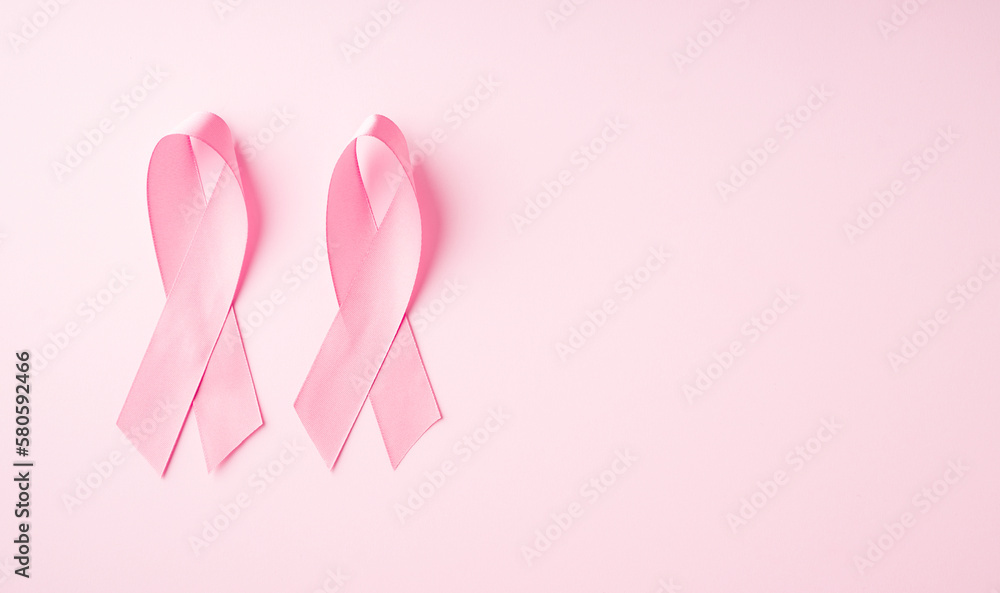 World breast cancer day concept with pink ribbon on pink background World breast cancer day concept with pink ribbon on pink background
