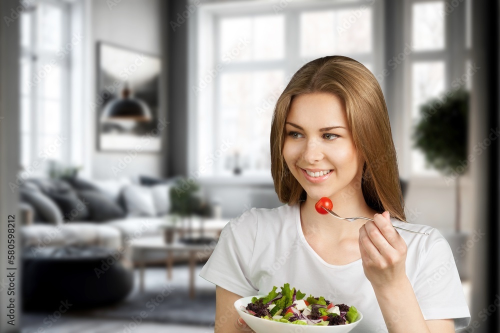 Funny young Woman Eating tasty salad Funny young Woman Eating tasty salad