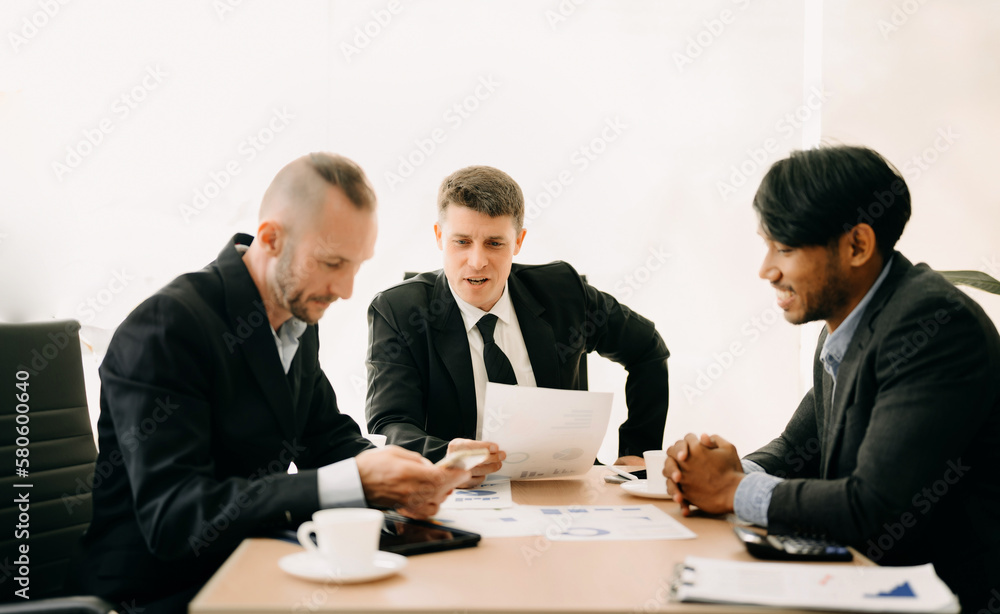 Business team discuss at meeting room. working together with laptop ,tablet and smart phone on desk Financial accountant , planner , meeting , introduction concept. At office. Business team discuss at meeting room. working together with laptop ,tablet and smart phone on desk Financial accountant , planner , meeting , introduction concept. At office.