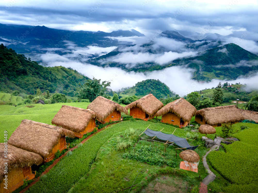View of Enjoy a panoramic view of wooden bungalows from above with breathtaking ...