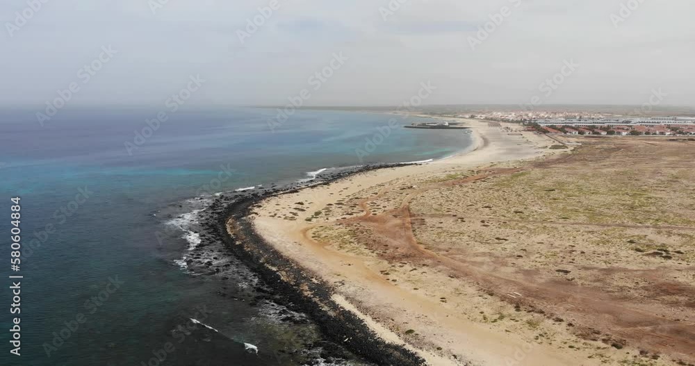 Coastline With View Of Bikini Beach In Background At Sal Cape Verde. Aerial Ascending Shot Coastline With View Of Bikini Beach In Background At Sal Cape Verde. Aerial Ascending Shot