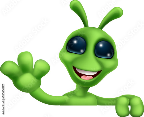 An alien cute little green man Martian cartoon mascot peeking over a sign and waving