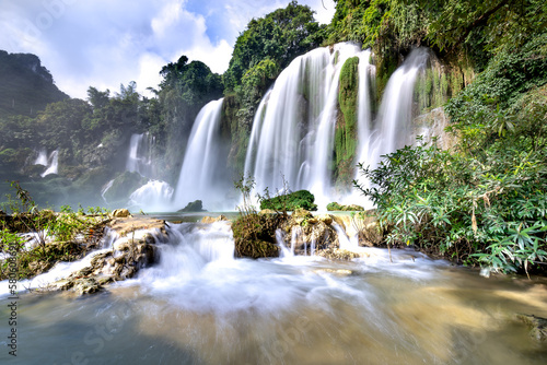 Ban Gioc Waterfall, Cao Bang Province, Vietnam - View panorama of Ban Gioc Waterfall on a sunny beautifull day. This is the largest and most beautiful waterfall in Southeast Asia.