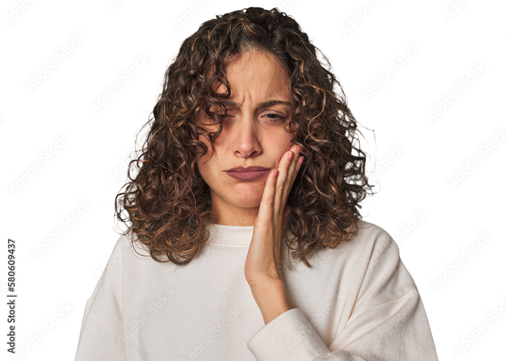 Radiant young woman with stunning curls having a strong teeth pain