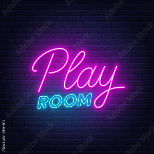 Play Room neon sign on brick wall background.