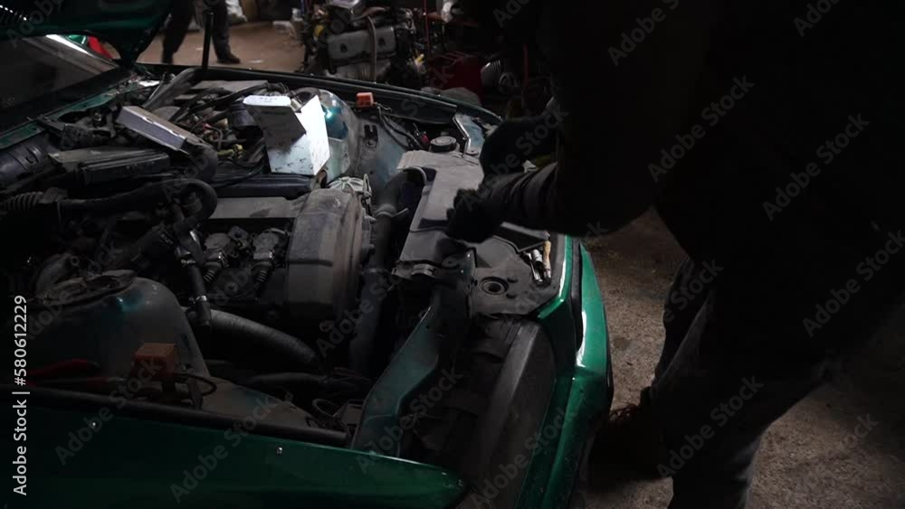 a mechanic disassembles a car to install a turbo engine tuning drift auto a mechanic disassembles a car to install a turbo engine tuning drift auto