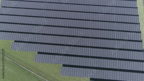 Drone aerial shot of solar panels on a field. photo