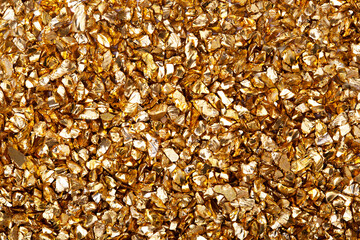 Gold nugget grains, gold background