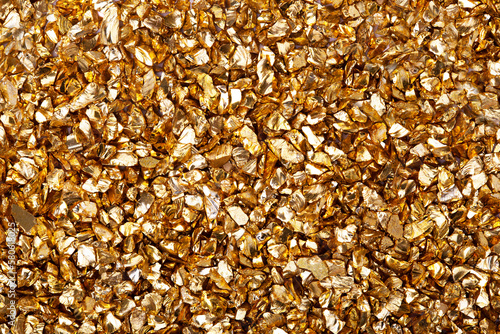 Gold nugget grains, gold background