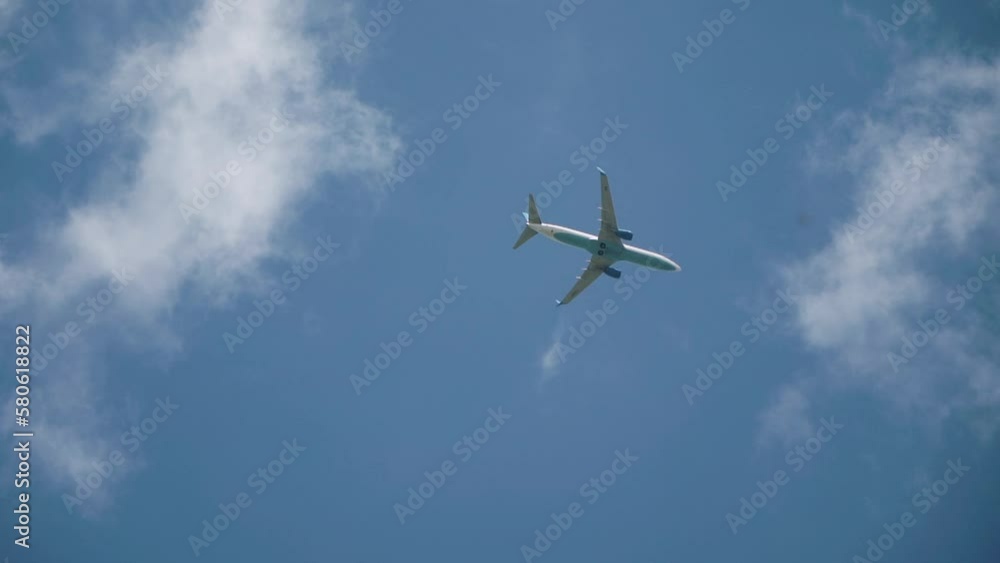 Passenger plane flying in the clouds Passenger plane flying in the clouds