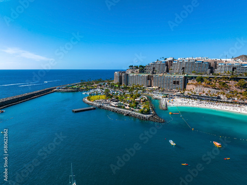 Wallpaper Mural Beautiful aerial landscape with Anfi beach and resort, Gran Canaria, Spain. Luxury hotels, turquoise water, sandy beaches in Spain. Luxury beach vacation concept. Heart shaped island. Torontodigital.ca